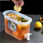 3.5L slim refrigerator water dispenser with a white tap and lid, filled with lemonade and fruit