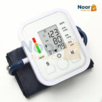 Automatic digital upper arm blood pressure monitor with a large LCD screen and gray arm cuff